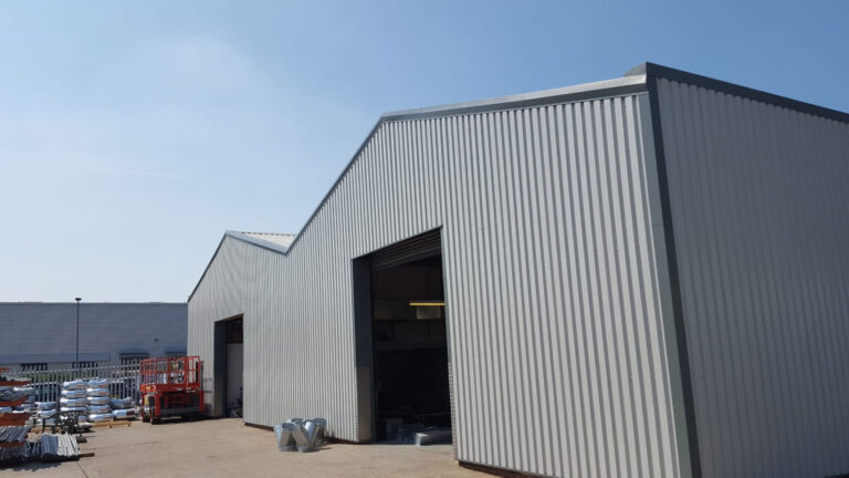 Modern commercial building in Dorset featuring sleek metal cladding, showcasing durability and aesthetic appeal.